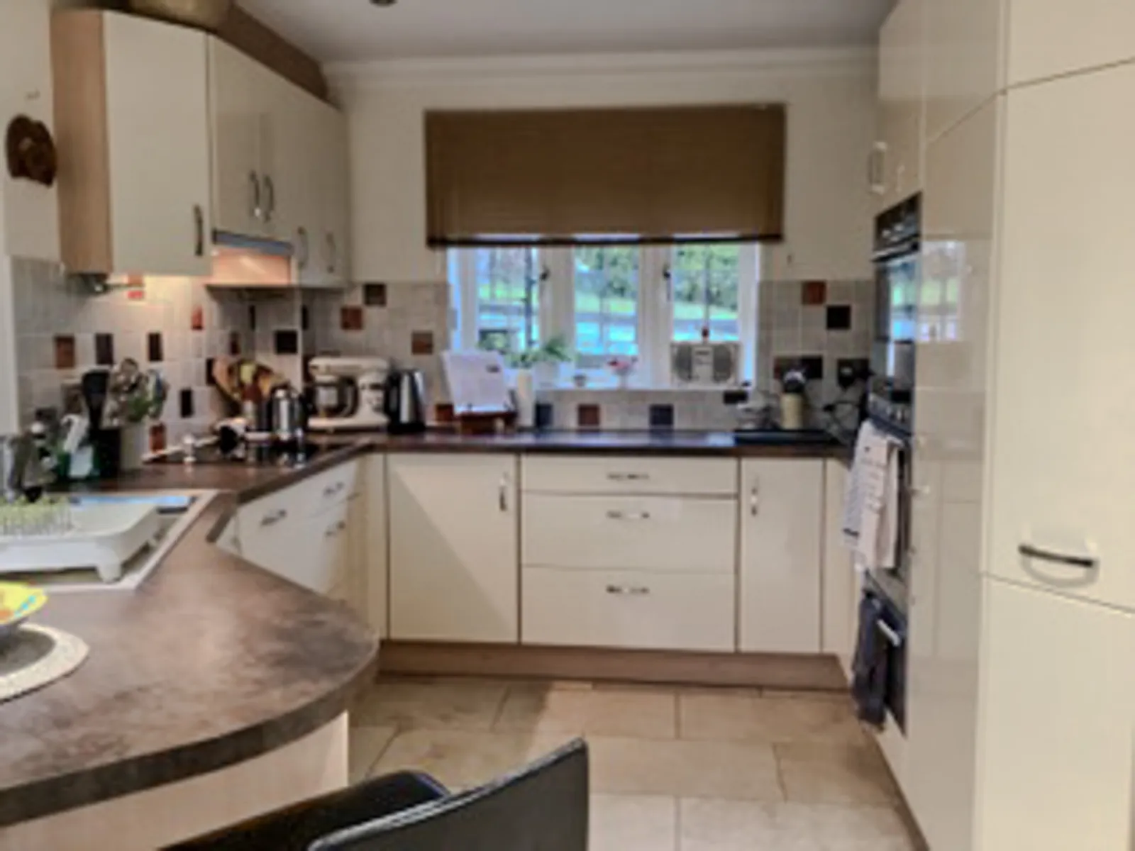 Brinkworth kitchen before the refresh, with cream cabinetry and dark worktops