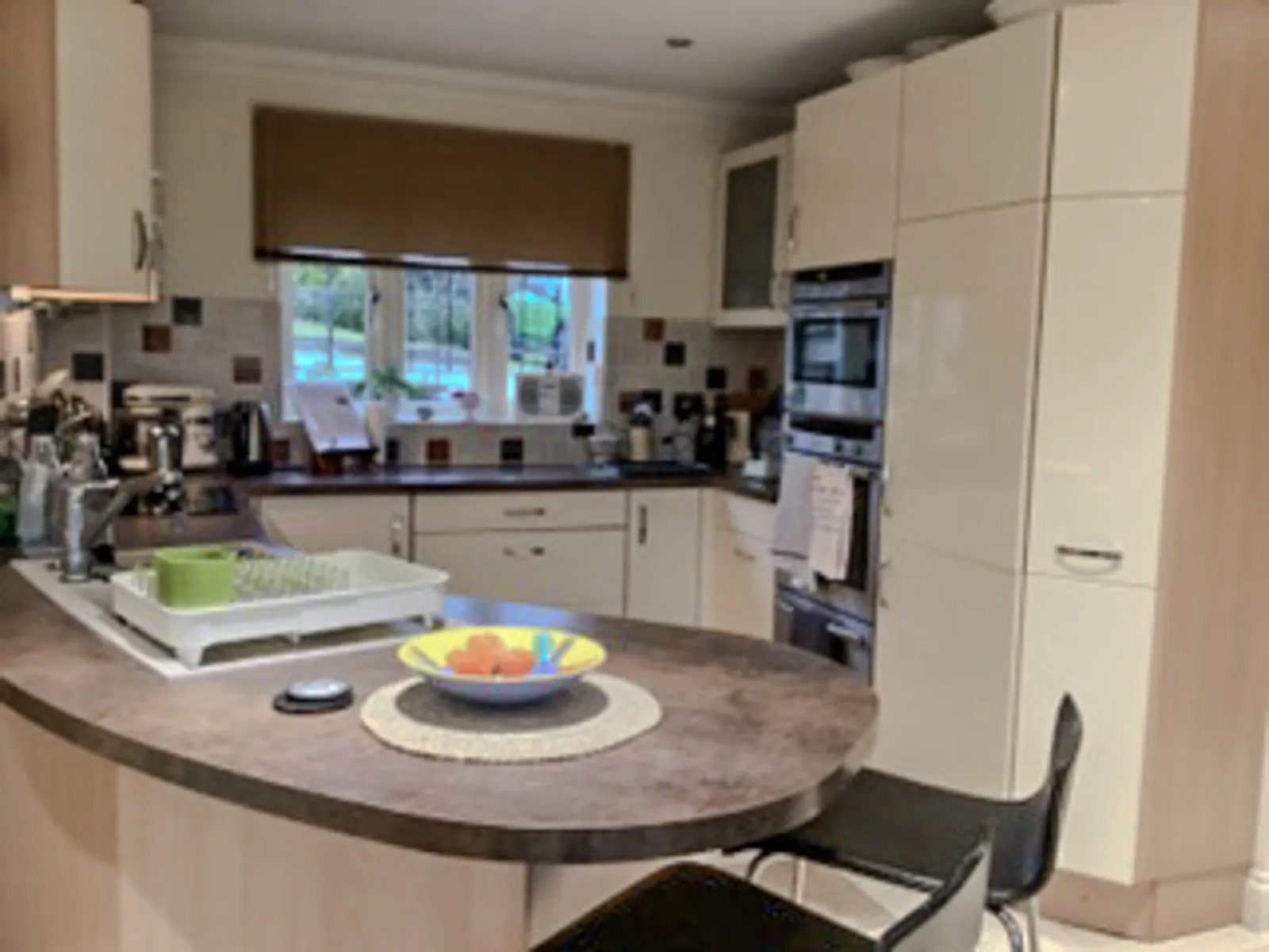 Brinkworth kitchen before the refresh, showing the curved breakfast bar and existing cabinets