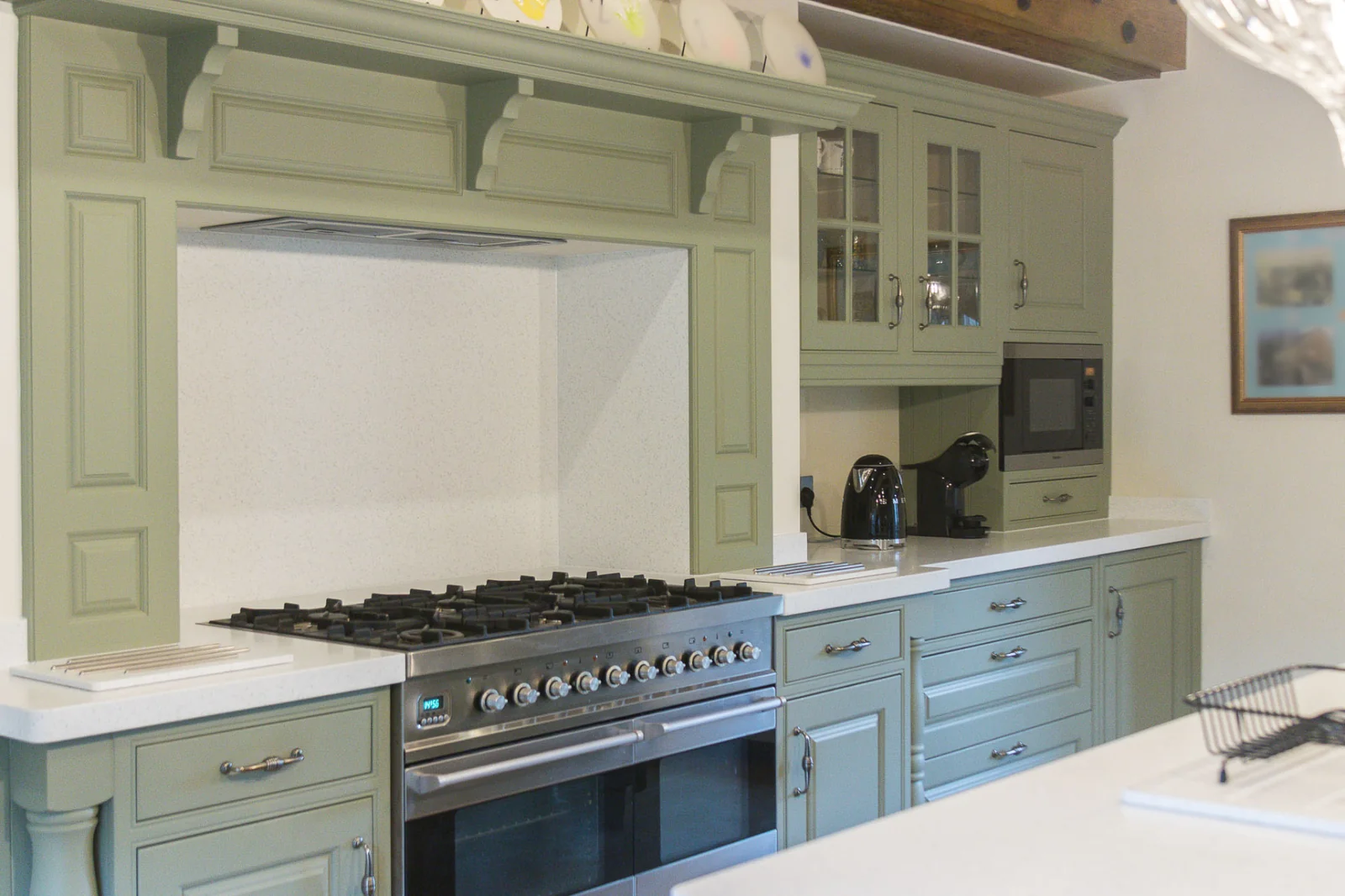 The finished kitchen after spraying in a fresh sage green colour