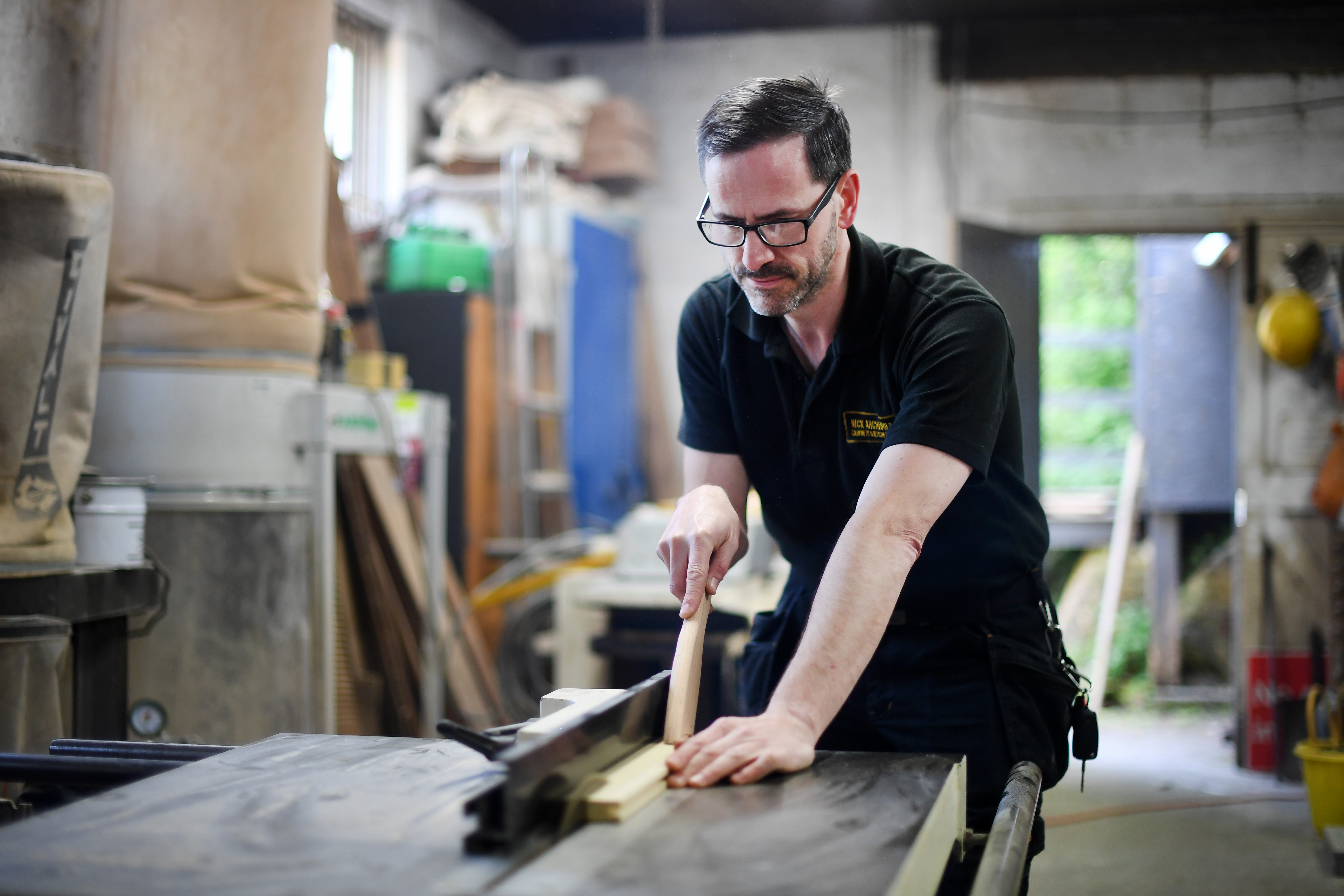 Nick surfacing timber on the machinery in his Corsham workshop.