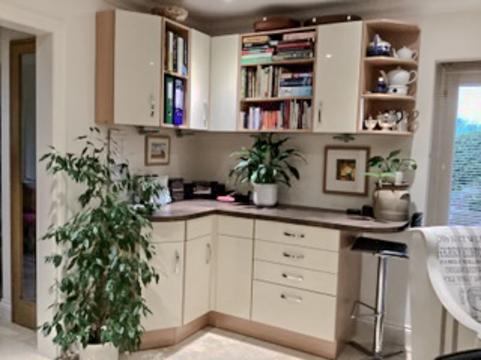 The Brinkworth study area before its refresh, with matching cream doors, a dark laminate worktop and open shelving
