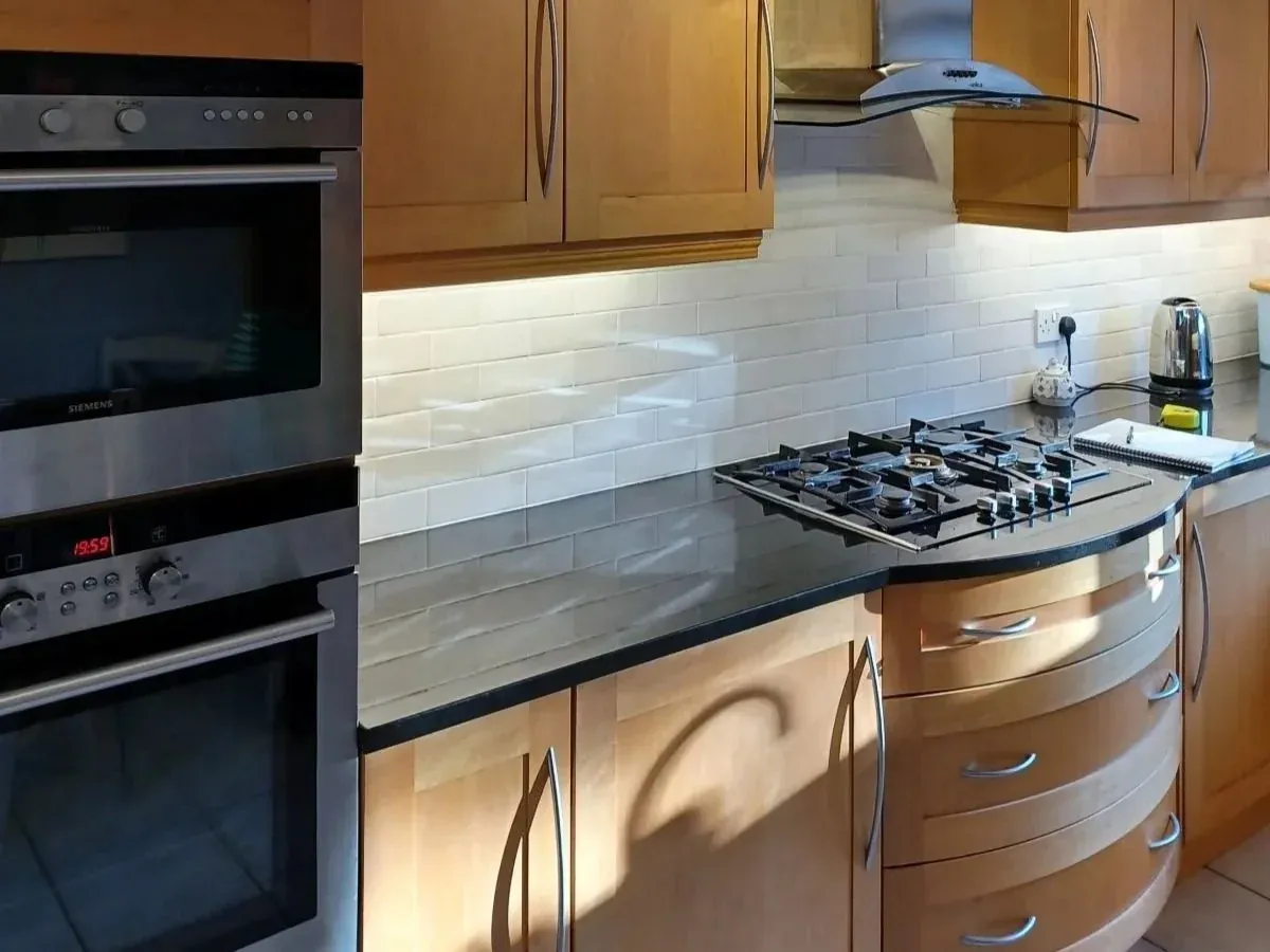 Dated kitchen with tired doors and worktops before a refresh