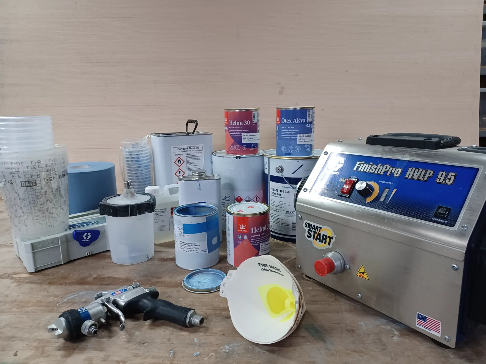 Professional cabinet spraying equipment in the workshop, set up for a smooth, furniture-grade finish that stands up to daily use.