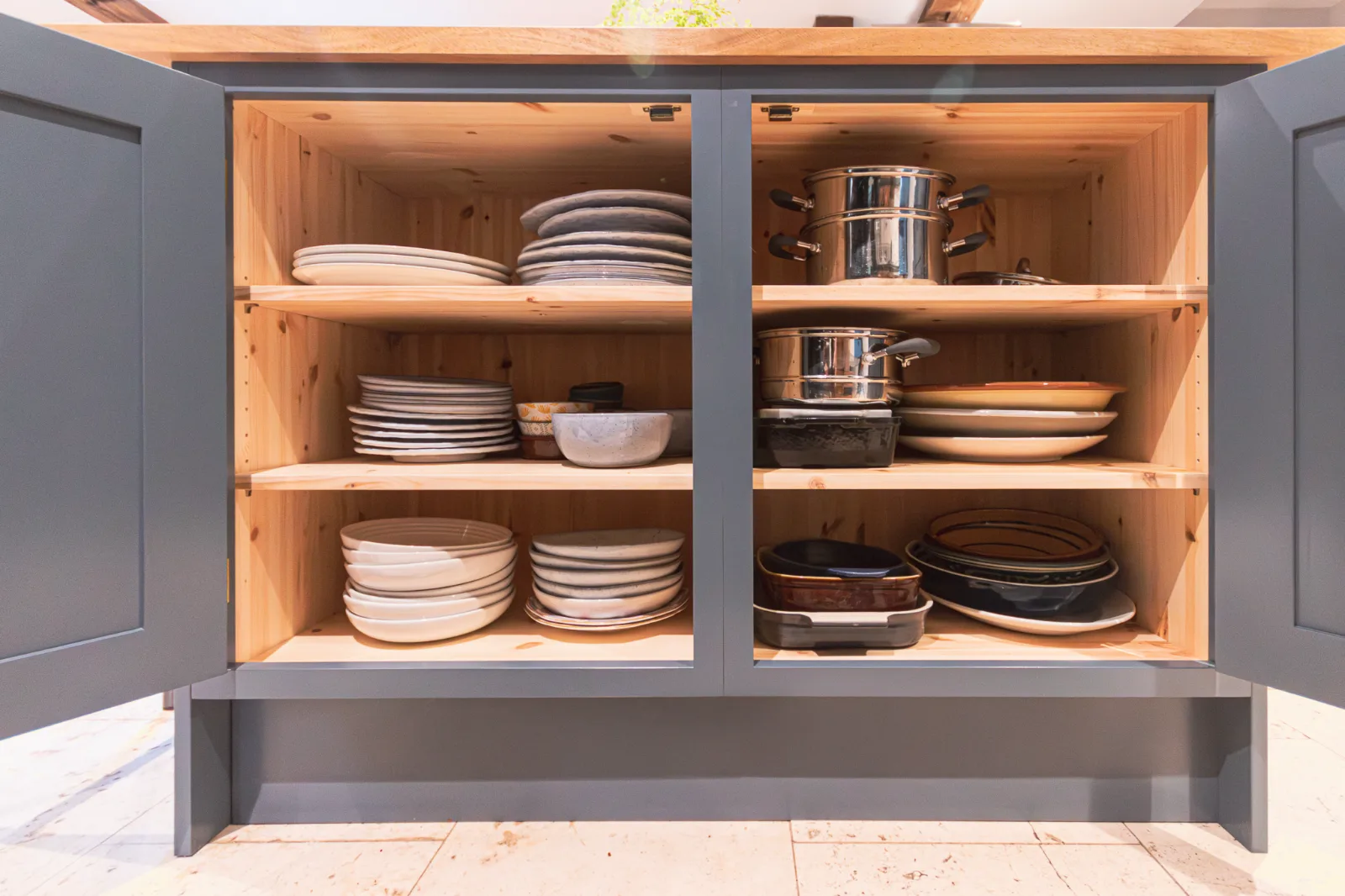 Solid pine carcasses. Ash frames and doors.