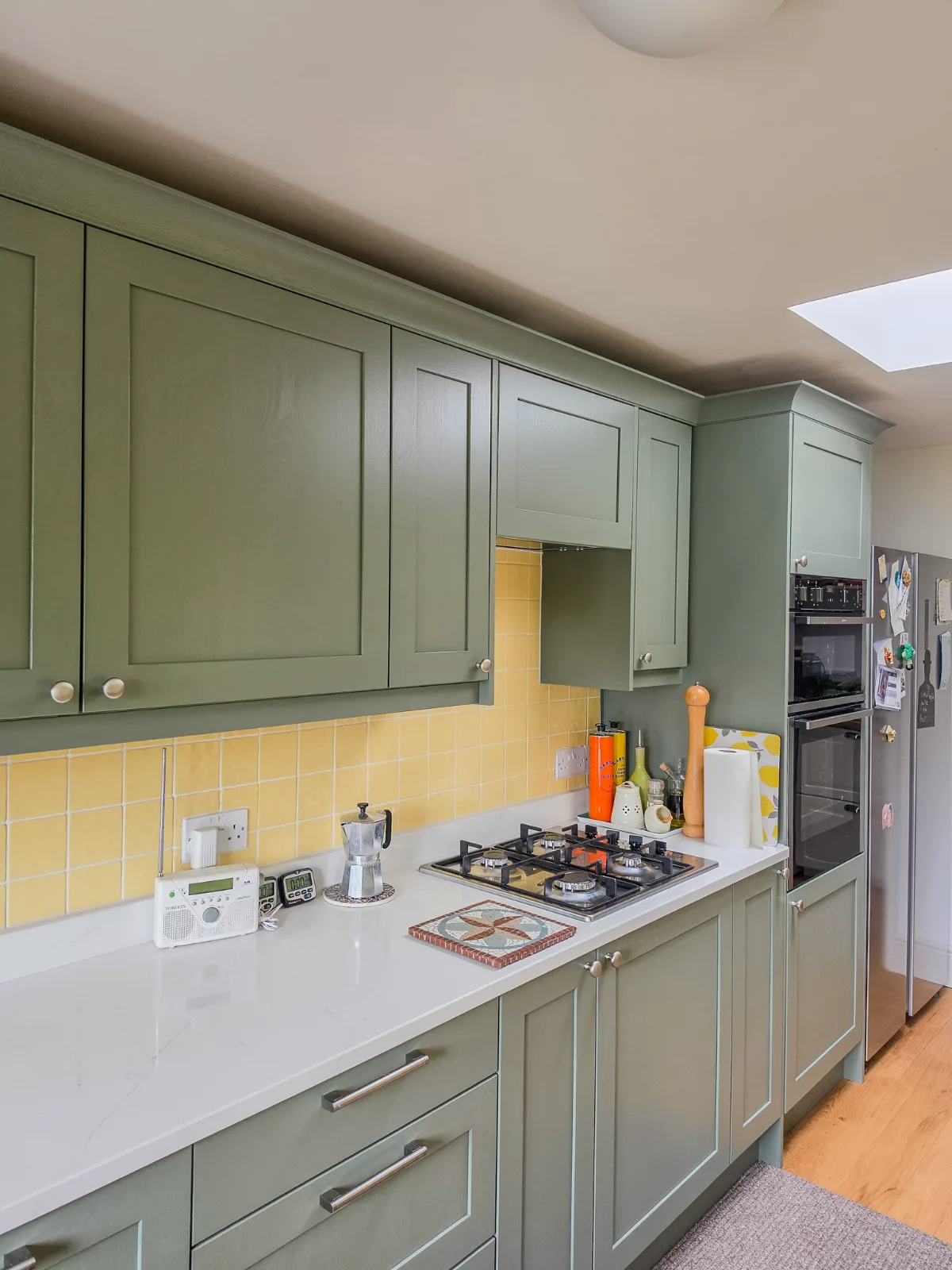 The new green doors blend with the existing floor and tiles.
