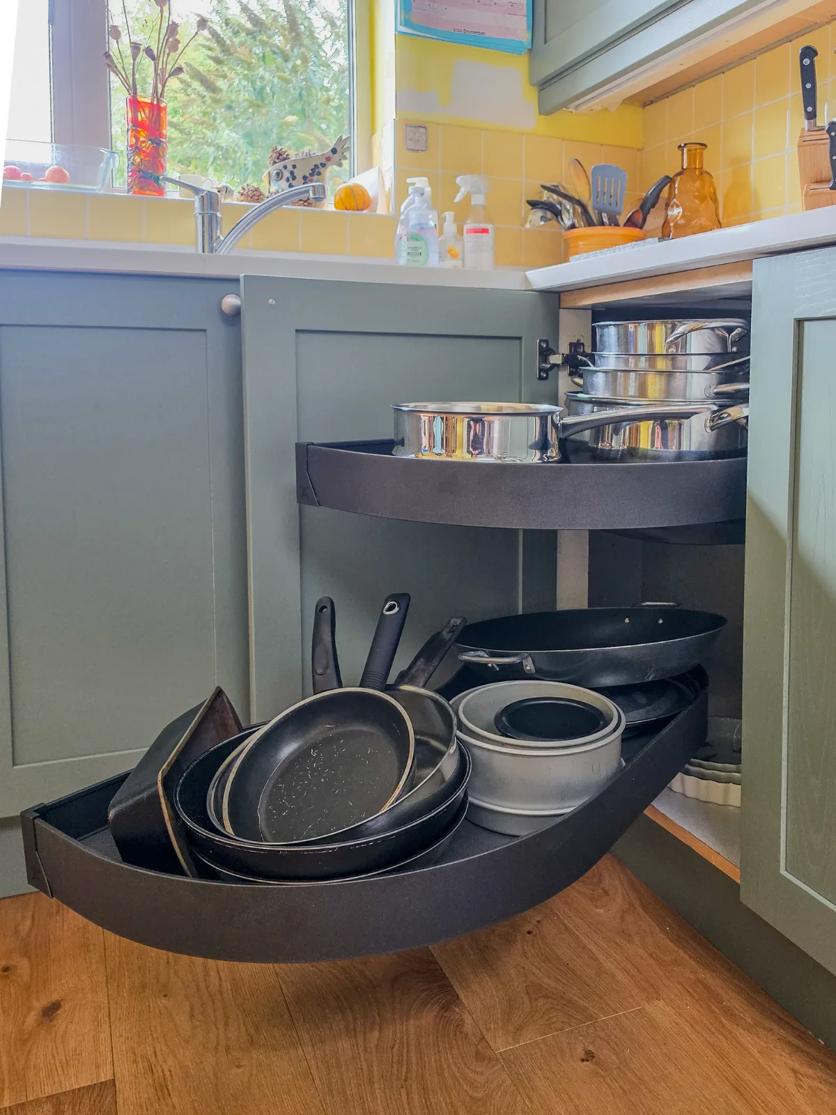 Retrofitted swing-out corner storage. 
