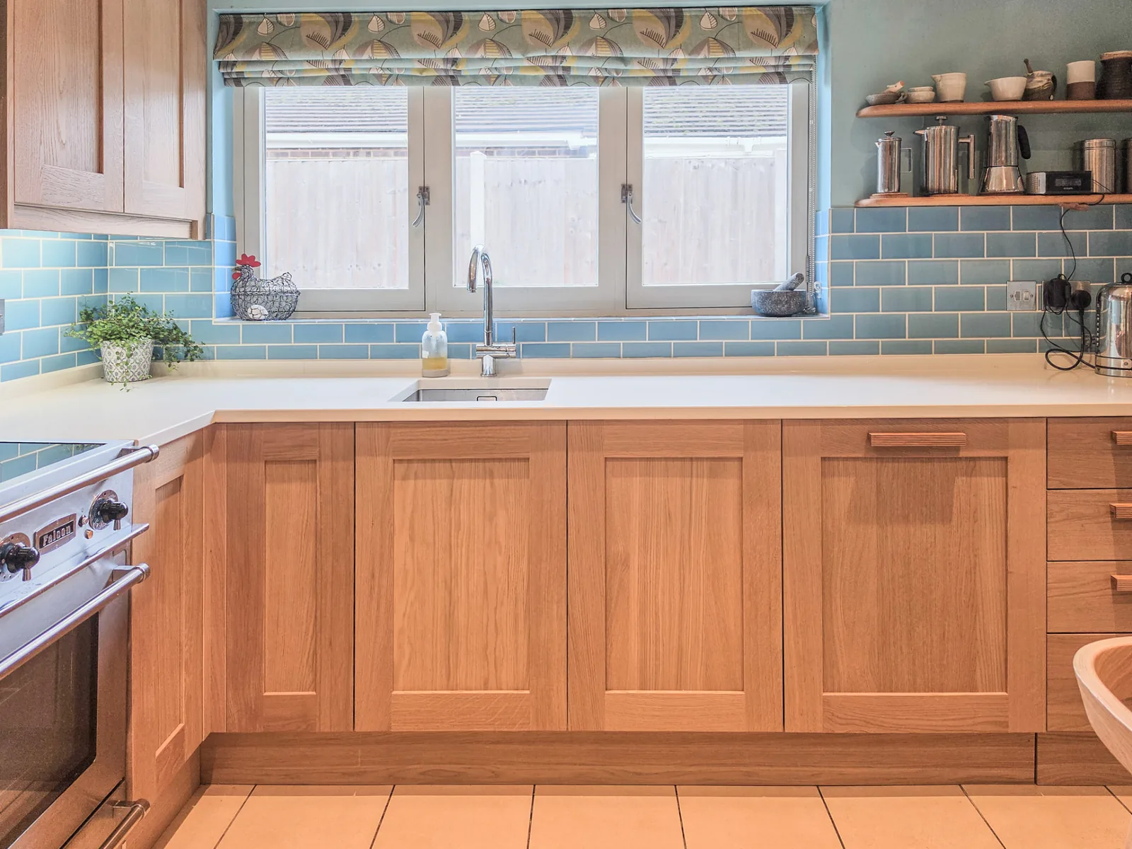 Solid oak replacement doors and quartz worktop along the sink run