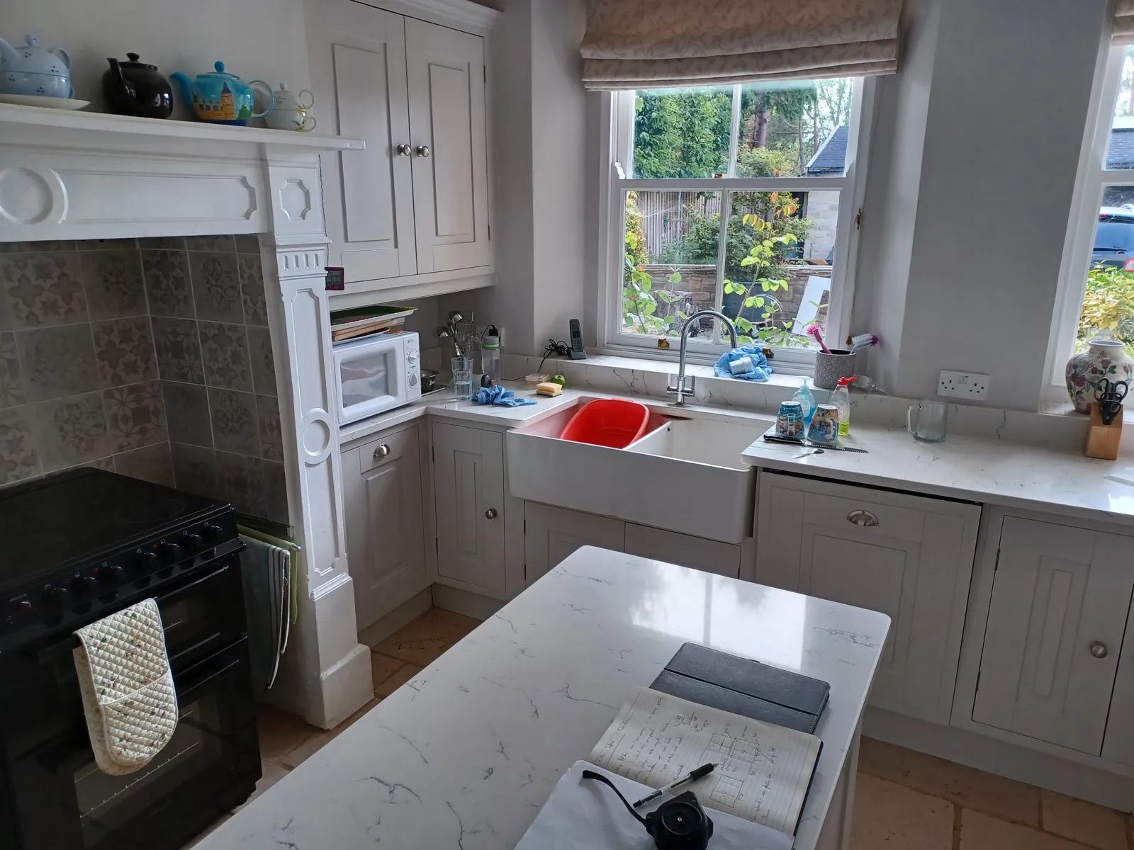 The Malmesbury kitchen before, with grey painted cabinets, range cooker and island